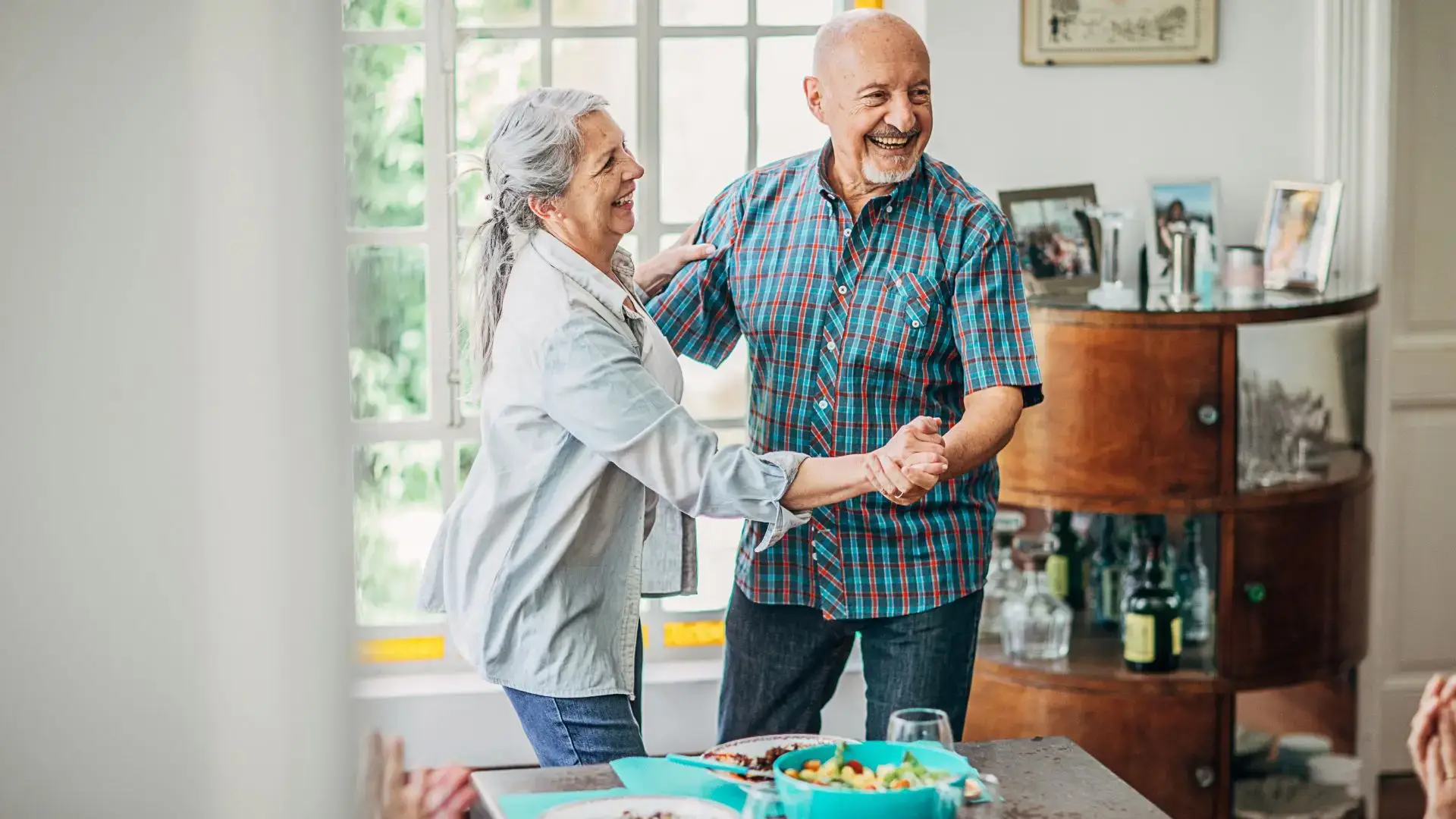 A-couple-dancing-in-the-living-room-1.webp
