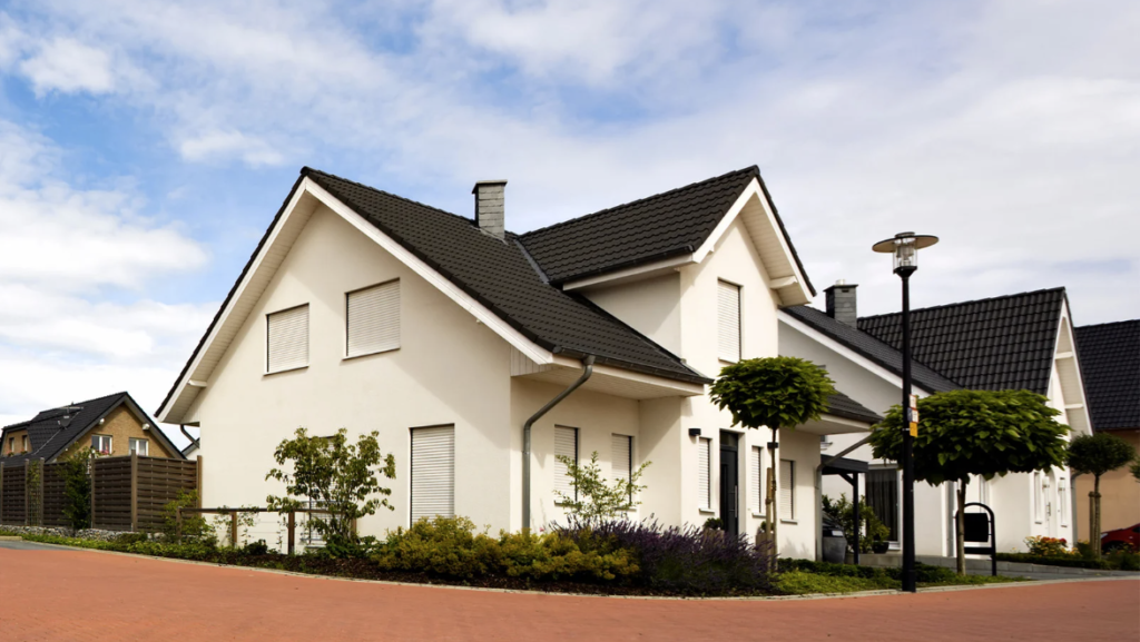 an image of a house with a driveway in front of it